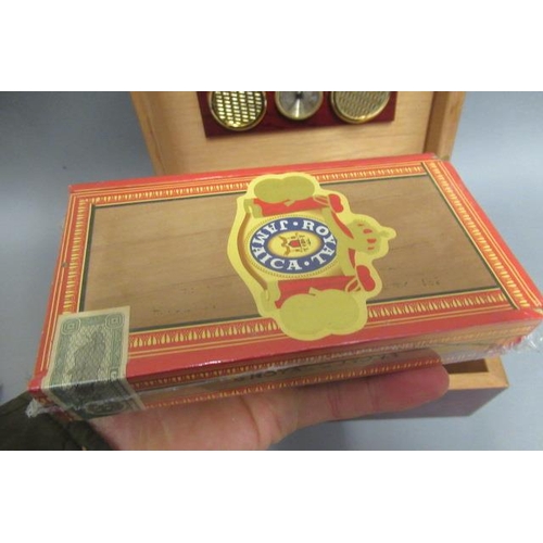 115 - A cedar humidor with hygrometer & Boveda 75, containing 5 Royal Jamaica coronas cigars and 25 Fonsec... 