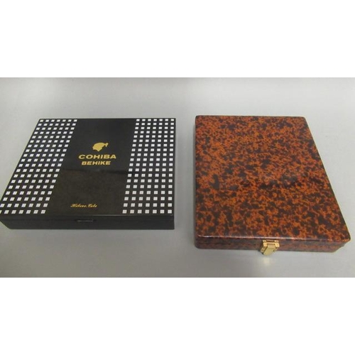 118 - Two cigar boxes, comprising 1 Cohiba Behike humidor and 1 tortoise effect presentation box to fit 12... 