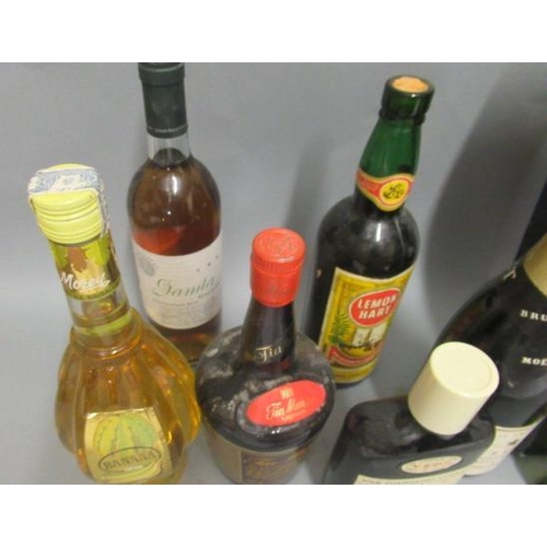 13 - An assortment of wine & liqueur, including 1 boxed Cherry Marnier, 1 Remy Martin fine champagne cogn... 