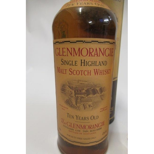 162 - Four bottles of whisky, comprising one litre 10yr old Glenmorangie single malt in tube, one litre Fa... 