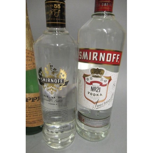 23 - 6 mixed bottles of spirits and sparkling wine, comprising 1 litre Smirnoff, 1 bottle Smirnoff Black,... 