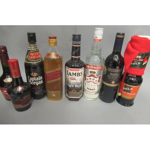 32 - 8 mixed bottles, including Johnnie Walker Red Label whisky, Captain Morgan rum, Lamb's Rum, Smirnoff... 