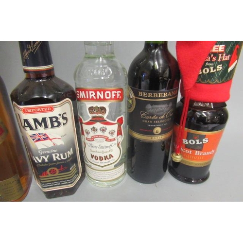 32 - 8 mixed bottles, including Johnnie Walker Red Label whisky, Captain Morgan rum, Lamb's Rum, Smirnoff... 