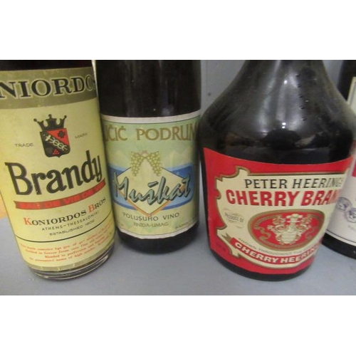 57 - 13 bottles of mixed spirits & liqueur, comprising 2 litres Campari, 1.5litre Cinzano Bianco, 1 Peter... 