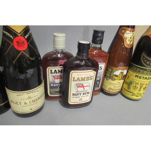 63 - 10 mixed bottles of alcohol, comprising 1 bottle Moet & Chandon Imperial Brut champagne, 1 Captain M... 