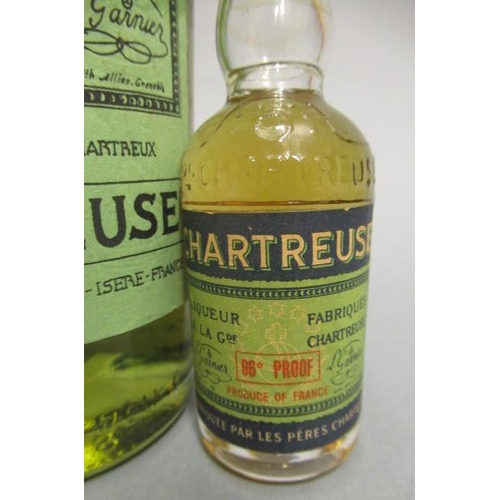 64 - 1 12fl. oz bottle Green Chartreuse, Garnier, together with a Yellow Chartreuse miniature