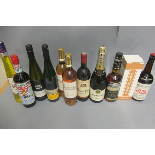 65 - 12 bottles of mixed alcohol, comprising 1 bottle Tattinger champagne, 1 Woods 100 Old Navy Rum, 1 Pe... 