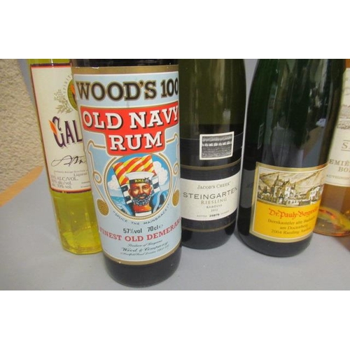 65 - 12 bottles of mixed alcohol, comprising 1 bottle Tattinger champagne, 1 Woods 100 Old Navy Rum, 1 Pe... 