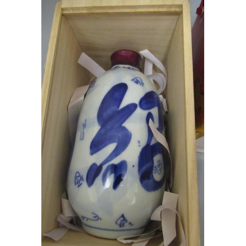 71 - 2 ceramic bottles of boxed rice wine (pagoda brand and other), together with a boxed Bertrand pear l... 