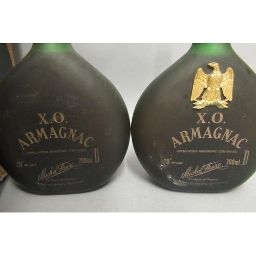 77 - 4 bottles of liqueur, comprising 2 bottles Michel Faure XO Armangnac, 1litre boxed Napoleon 12yr old... 