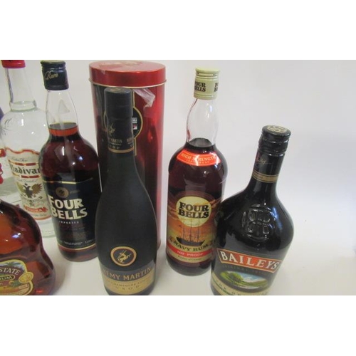 90A. - 11 bottles of mixed spirits & liqueurs, comprising 3 bottles Smirnoff vodka, 1litre Vladivar vodka, ... 