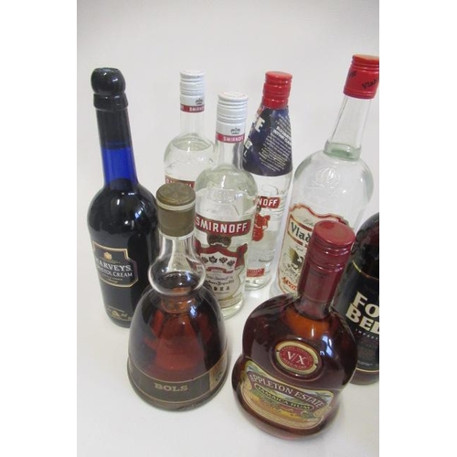 90A. - 11 bottles of mixed spirits & liqueurs, comprising 3 bottles Smirnoff vodka, 1litre Vladivar vodka, ... 