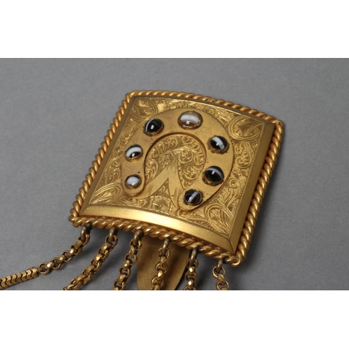 126 - A VICTORIAN GILT METAL CHATELAINE, the square convex panel engraved with scrolling foliage and centr... 