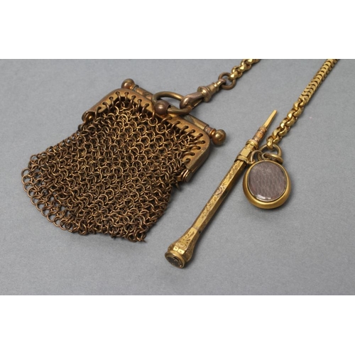 126 - A VICTORIAN GILT METAL CHATELAINE, the square convex panel engraved with scrolling foliage and centr... 