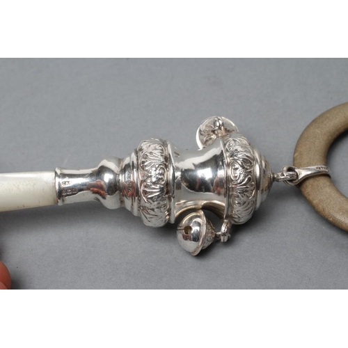 135 - A SILVER RATTLE, maker Crisford & Norris, Birmingham 1938, the spool finial with foliate chased rims... 