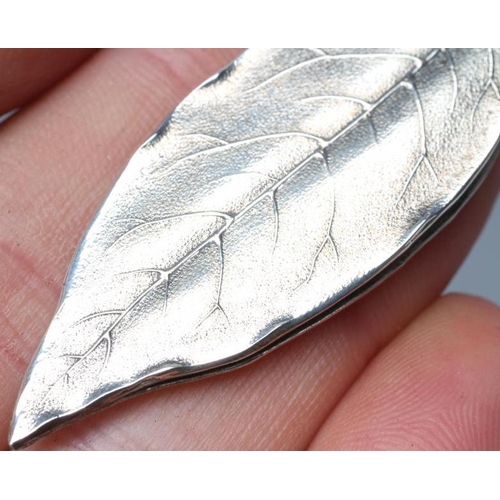 144 - A STERLING SILVER MONEY CLIP, maker Tiffany & Co., cast in the form of a leaf, 2 1/2