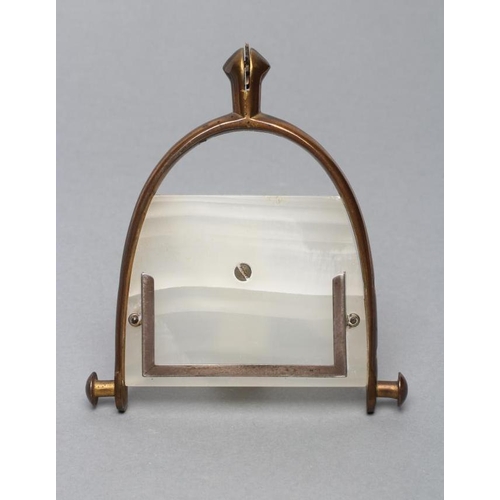 148 - AN ART DECO WHITE ONYX PERPETUAL CALENDAR, the strut back supported on a spurred stirrup stand stamp... 