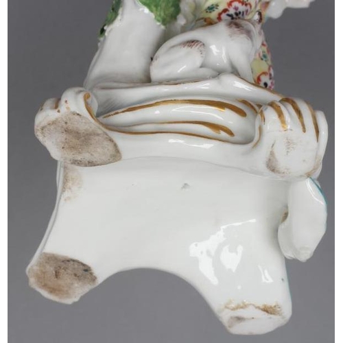 15 - A CHELSEA PORCELAIN FIGURE, c.1765, modelled as a young gentleman wearing a broad brimmed hat, pink ... 