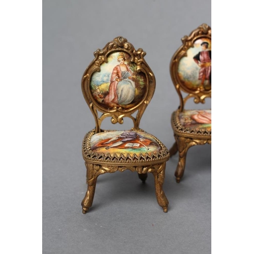 160 - AN AUSTRIAN GILT METAL AND ENAMEL MINIATURE BOUDOIR SET, painted in colours with figures in 18th cen... 