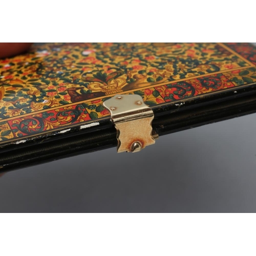 165 - A PERSIAN LACQUERED VISITING CARD CASE, mid 19th century, of plain oblong form, painted in colours a... 