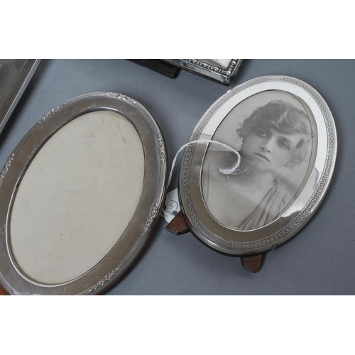 217 - A COLLECTION OF FIVE EASEL BACK PHOTOGRAPH FRAMES, comprising two oval, Chester 1919, 6 1/4