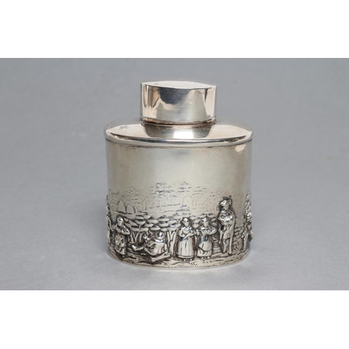 225 - A TEA CANISTER, maker's mark rubbed, Chester 1935, of oval form, chased in the Dutch style with a co... 