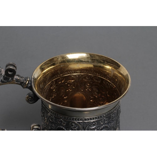 298 - A RUSSIAN TANKARD, post 1876, 84 standard, of swept cylindrical form chased with six vacant oval bos... 