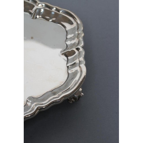 299 - A LATE VICTORIAN WAITER, maker Huttons, London 1895, of shaped circular form with pie-crust rim, rai... 