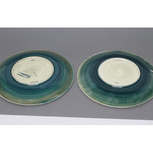 32 - TWO MOORCROFT POTTERY PLATES, mid 20th century, both of plain circular form, tubelined and painted i... 