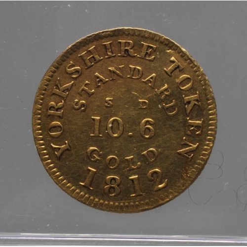 323 - A GEORGE III GOLD HALF GUINEA TOKEN, 1812, by Younge & Wilson of Sheffield, EF, 3.2g, with Royal Min... 