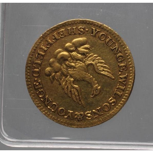 323 - A GEORGE III GOLD HALF GUINEA TOKEN, 1812, by Younge & Wilson of Sheffield, EF, 3.2g, with Royal Min... 