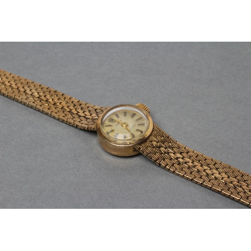 347 - A LADY'S 9CT GOLD ROLEX WRISTWATCH, the dark champagne dial with gilt metal batons, un-numbered eigh... 