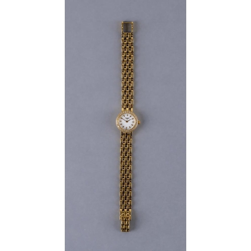 351 - A LADY'S LONGINES 18CT GOLD AND DIAMOND WRISTWATCH, the white dial with gilt batons, the quartz five... 