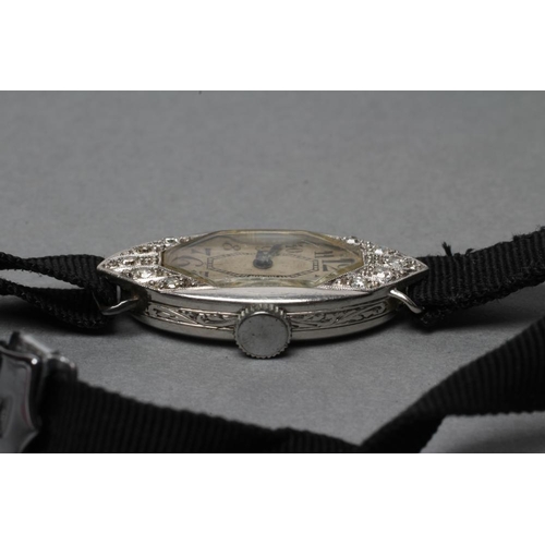 359 - A DIAMOND COCKTAIL WATCH, the shaped oblong silvered dial with black Arabic numerals, un-named fifte... 