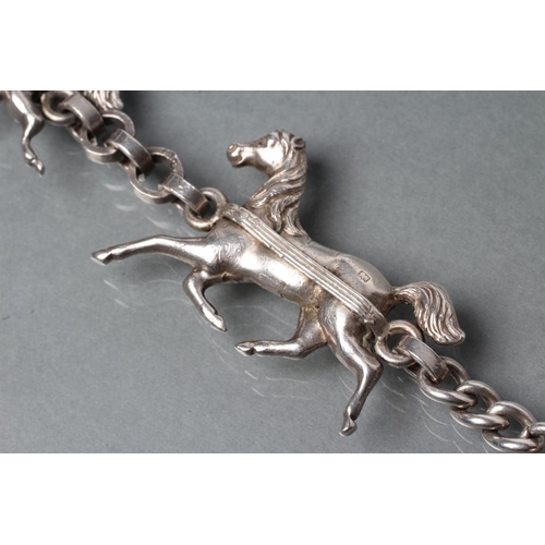 365 - A HEAVY SILVER TRIPLE HORSE BRACELET, the three dimensional cast carriage horses with plain circular... 