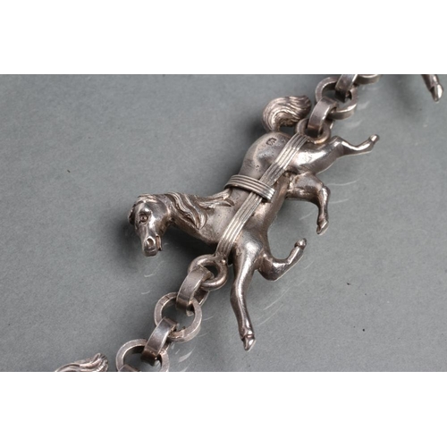 365 - A HEAVY SILVER TRIPLE HORSE BRACELET, the three dimensional cast carriage horses with plain circular... 