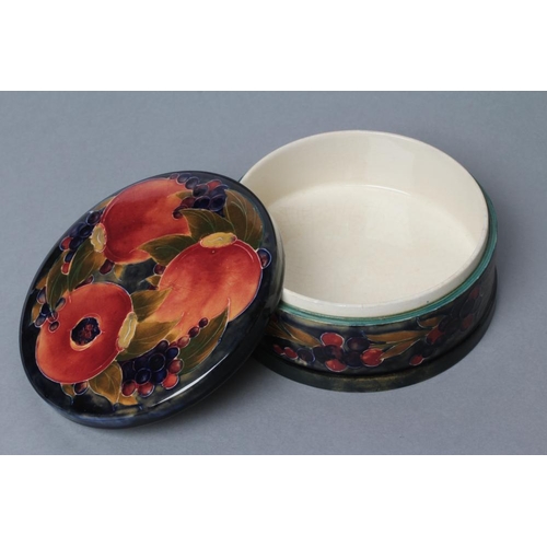 37 - A MOORCROFT POTTERY POMEGRANATE PATTERN LARGE BOX AND COVER, early 20th century, of plain cylindrica... 