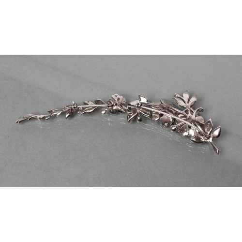 375 - A MID CENTURY PASTE AND SILVER TWO PIECE BROOCH, the double flower head stem with pin and loop suppo... 