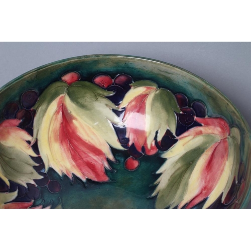 38 - A MOORCROFT POTTERY LEAVES AND POTTERY PATTERN BOWL, mid 20th century, tubelined and painted in typi... 