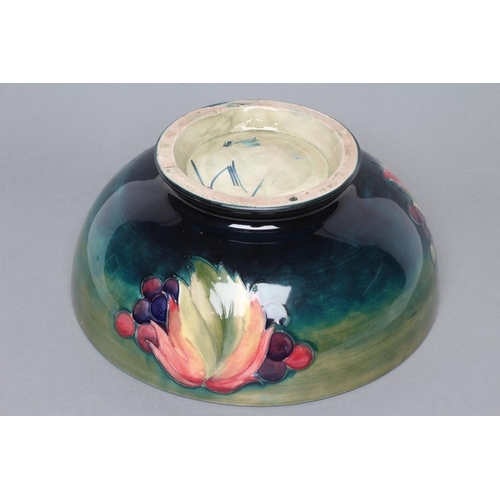 38 - A MOORCROFT POTTERY LEAVES AND POTTERY PATTERN BOWL, mid 20th century, tubelined and painted in typi... 