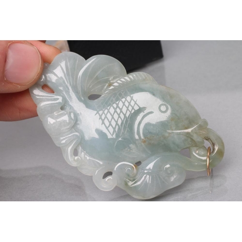 380 - A JADE PENDANT, the flat panel carved and pierced as a fish, on an unmarked loop (Est. plus 21% prem... 