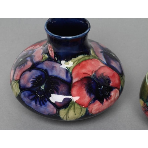 39 - A MOORCROFT POTTERY PANSY PATTERN VASE, mid 20th century, of squat globular form, tubelined and pain... 