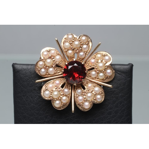 393 - A 9CT GOLD FLOWERHEAD BROOCH, each of the five petals set with seven seed pearls with plain bar spac... 