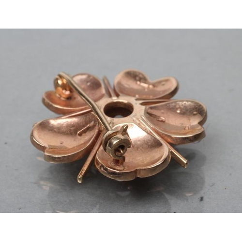 393 - A 9CT GOLD FLOWERHEAD BROOCH, each of the five petals set with seven seed pearls with plain bar spac... 