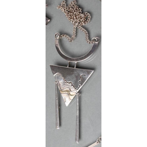 394 - A MODERN SILVER PENDANT, maker's mark possibly JC, London 1981, the triangular panel hung with two s... 