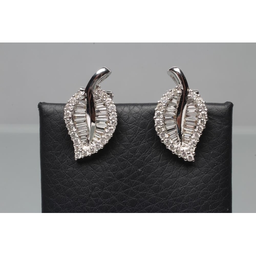 403 - A PAIR OF DIAMOND FRENCH CLIP EARRINGS, the leaf shaped panels set with baguette and brilliant cut s... 