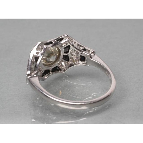 406 - AN ART DECO DIAMOND AND ONYX COCKTAIL RING, the old brilliant cut stone of approximately 1ct, open b... 