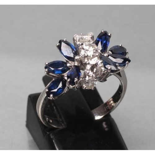 413 - A SAPPHIRE AND DIAMOND DRESS RING, the two marquise set sapphire 