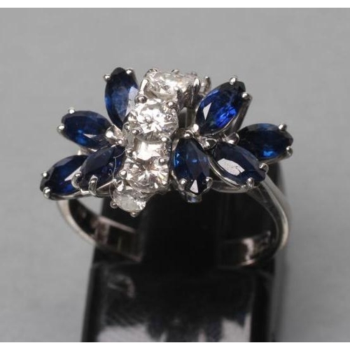 413 - A SAPPHIRE AND DIAMOND DRESS RING, the two marquise set sapphire 