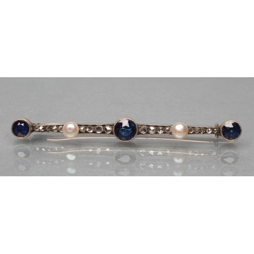 415 - A SAPPHIRE AND DIAMOND BAR BROOCH, open back collet set with three circular sapphires, rose cut diam... 